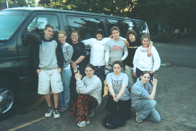 Youth by van before putting on packs