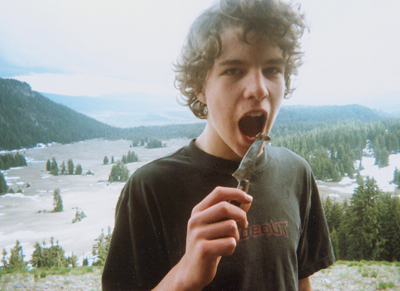 Derek about to eat large bug on knife