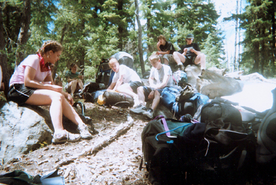 Youth resting along trail