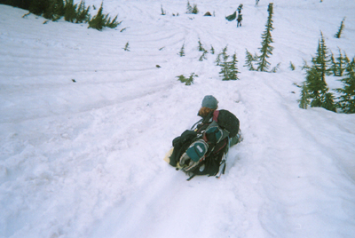 Debby sliding down a steep snowy slope