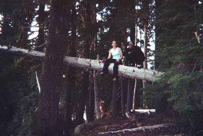Suzo & Mark sitting high on a log