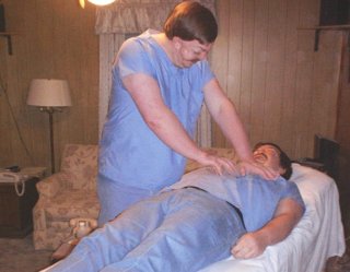 Picture of reiki on the
          chest, while the person is lying on his back