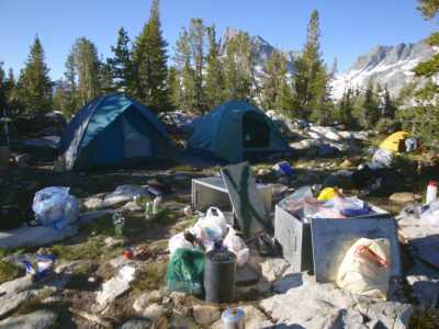 Camp, with Banner Peak through the trees