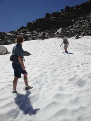 Gary and Jeff glissade down a large snowfield