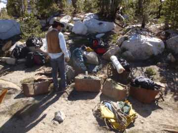 The packer wrangles our gear onto pack mules