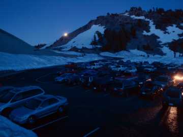 Busy Lassen Peak trailhead parking lot at moonset