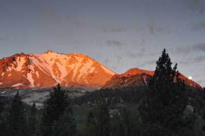 First light on Lassen Peak, moonset