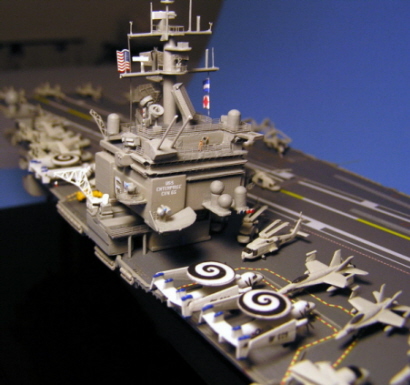 Close-up of the island, showing the new top deck I had to add, along with all the scratchbuilt radars, sensors, etc. Look closely at the front of the bridge - there are two people there. The E2-C Hawkeyes have the distinctive spiral logo of VAW-123, "The Screwtops," on top of their radar domes.
