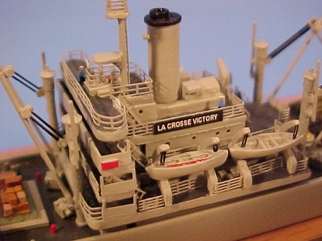 Another view of the superstructure. Red rectangle is port running light. Victory ships had four lifeboats, two powered and two with oars. Red oar in No. 1 lifeboat denotes the steering oar. Note photoetched lifeboat falls (lowering ropes).