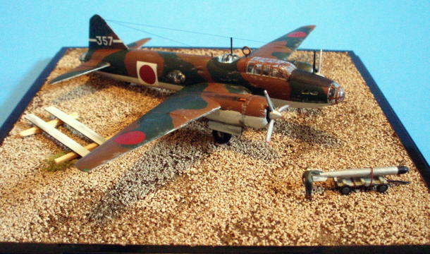Right side view. Most of the photos I had showed a crowd of like 20 guys manhandling a torpedo under the bomb bay, but ... No. 1, I didn't have than many 1/144 people, and No. 2, painting just this small number is hard enough! The ground crew are technically German NATO figures from Preiser, but I figured at this scale, one coveralled figure pretty much looks like another.