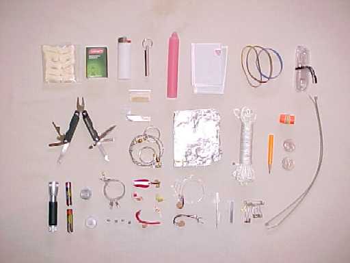 Large Personal Survival Kit showing the various ways to make fires, catch and cook food, make repairs and improvise equipment.