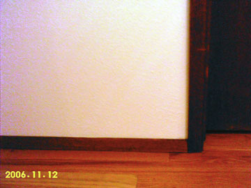 New larger baseboards anchor the room.