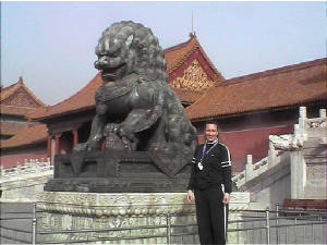 El In China Beside A Dragon Sculpture