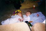 With his friend baby Sarah (Left)