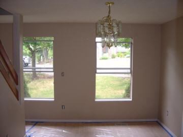 Looking back across the dining room out the front windows