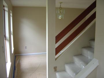 Looking left from the entry past the stairs to the dining room