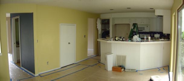 Through the family room to the kitchen and doorway to dining room