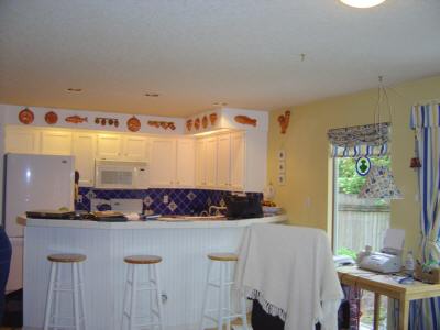 Looking across the breakfast bar to the kitchen