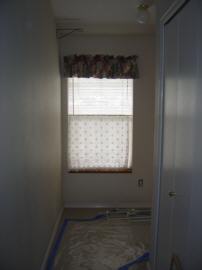 Hallway towards street leads to the guest room