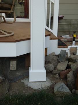 Detail of a caulked and painted pergola post