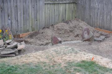 Starting to build up a retaining wall in front of the berm