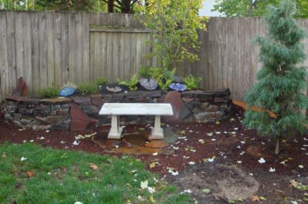 Finished wall, berm, plantings and bench